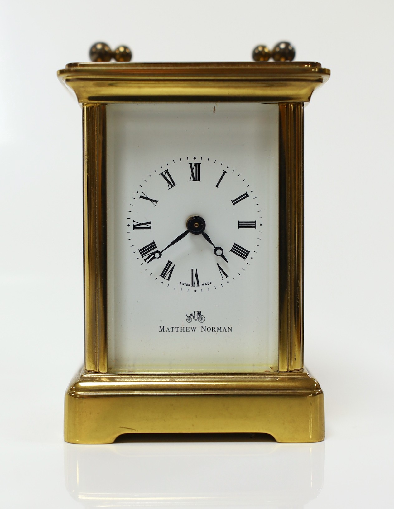 A Matthew Norman small brass carriage timepiece, 8cms high